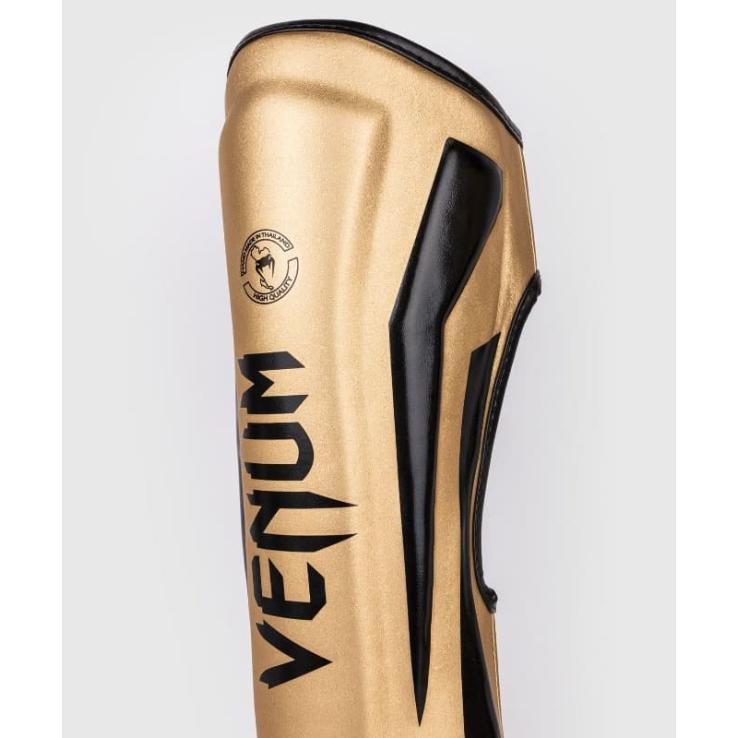 Venum Elite scheenbeschermers goud/zwart